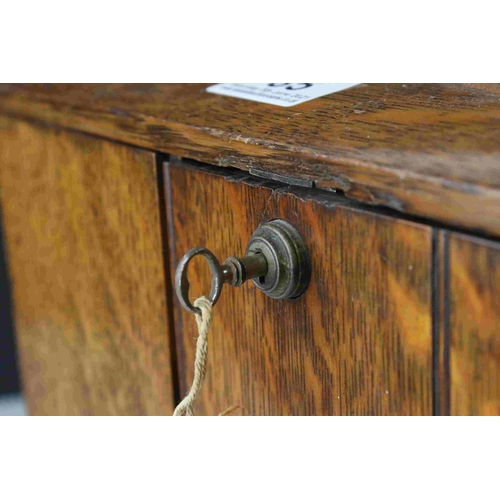 85 - A vintage lockable desktop cabinet with two internal drawers.