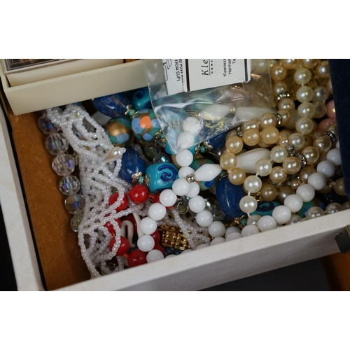 366 - A collection of mainly vintage costume jewellery contained within a vintage jewellery box.