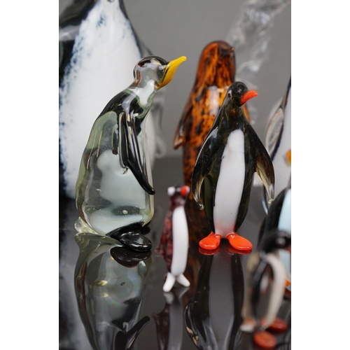 381 - A collection of glass Penguin figures to include Wedgewood and Murano examples.