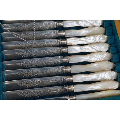 389 - A cased set of twelve silver plated knives and forks with mother of pearl handles and hallmarked sil... 