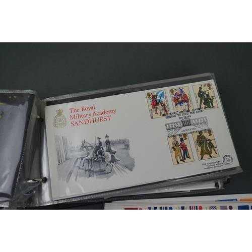 394 - A collection of British first day covers contained within an album together with some loose examples... 