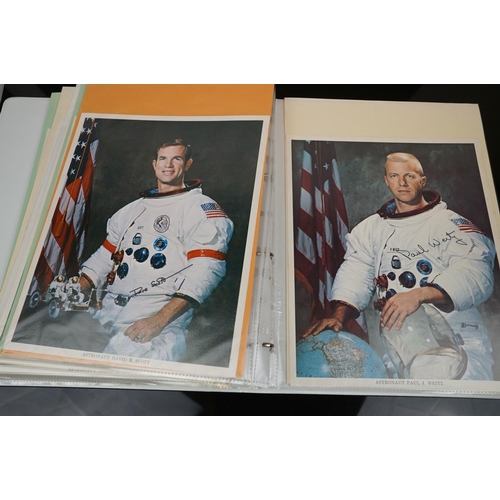 395 - A collection of space flight ephemera to include first day covers and signed photographs.