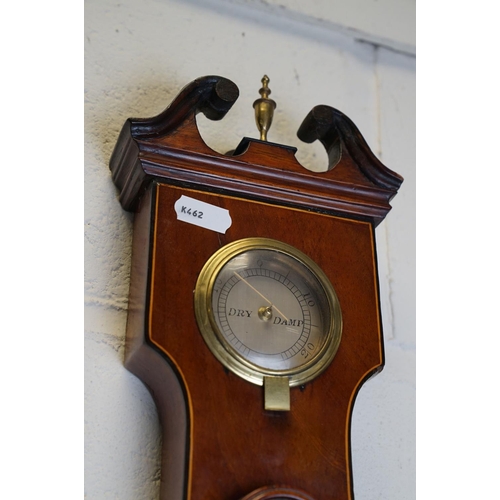 401 - An antique mahogany cased L Martinelli of London banjo Barometer.