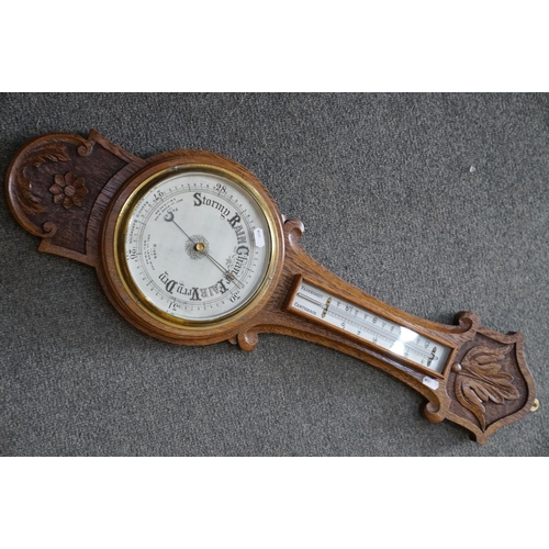 438 - An oak cased barometer, 20th century.