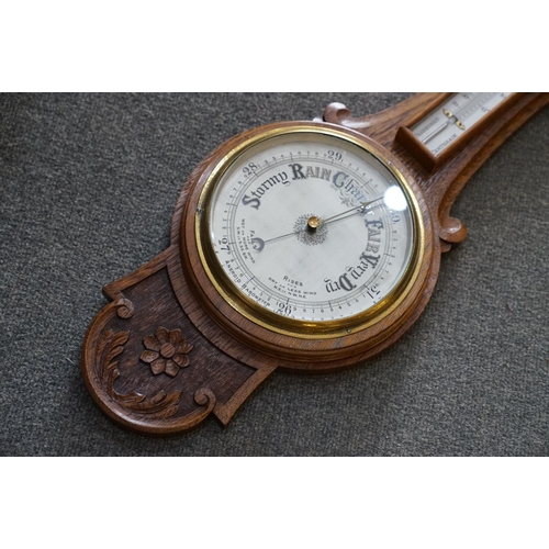 438 - An oak cased barometer, 20th century.