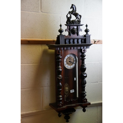 439 - A Vienna style mahogany cased two train wall clock.