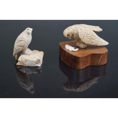 353 - A pair of Inuit carved Whale bone figures of birds of prey, one mounted to wooden base.