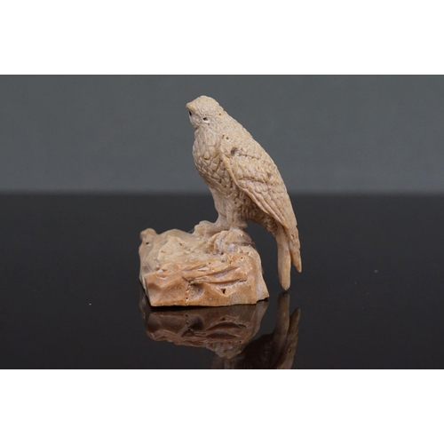 353 - A pair of Inuit carved Whale bone figures of birds of prey, one mounted to wooden base.