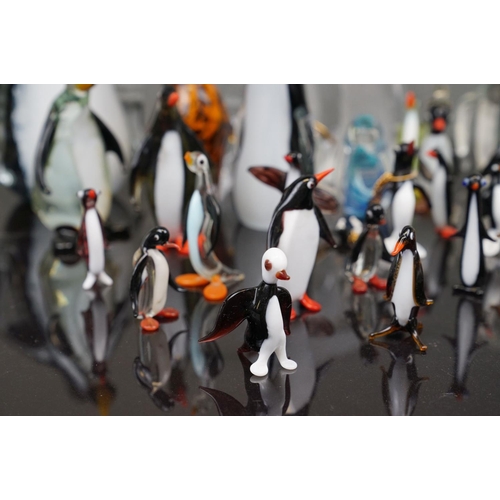 381 - A collection of glass Penguin figures to include Wedgewood and Murano examples.