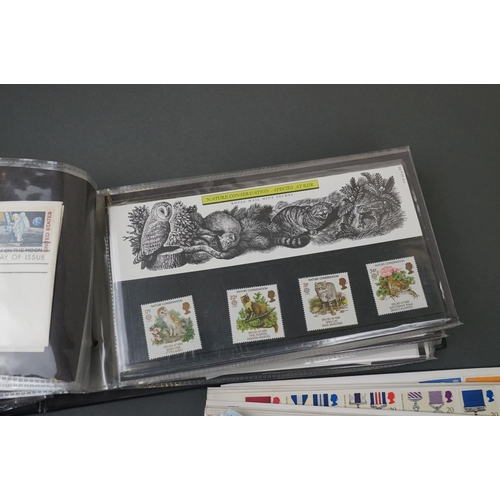 394 - A collection of British first day covers contained within an album together with some loose examples... 