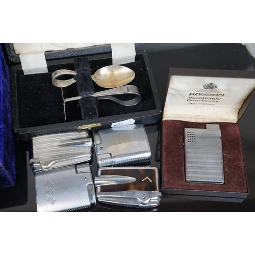 397 - A box of mixed collectables to include vintage Ronson lighters, silver plated cutlery and brass orna... 