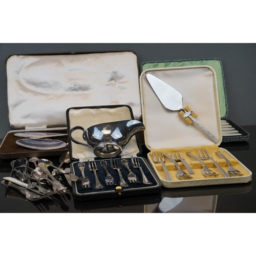 398 - A collection of silver plated cutlery to include cased knives and forks.