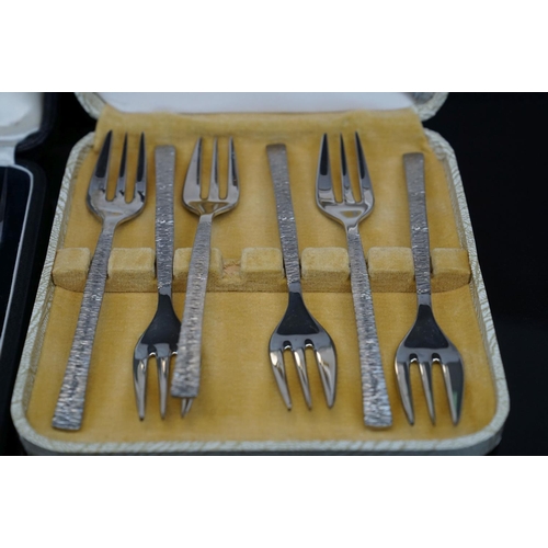 398 - A collection of silver plated cutlery to include cased knives and forks.