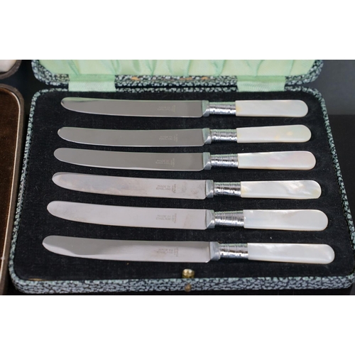 398 - A collection of silver plated cutlery to include cased knives and forks.