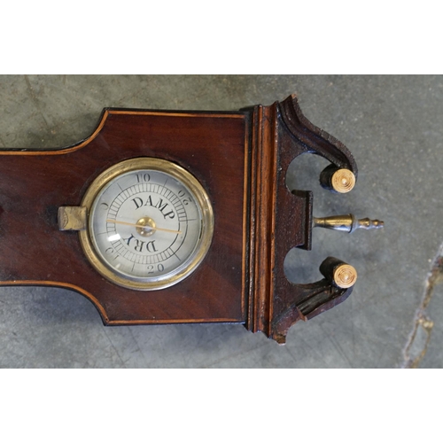 402 - An antique Kidby Weeley mahogany cased banjo barometer.