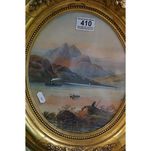 410 - An early 20th century oval gilt framed watercolour, mountain lake scene with fishermen and a steam p... 