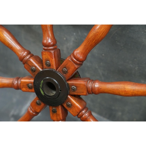 440 - A large Contemporary hardwood ships wheel, 150 cm in diameter.