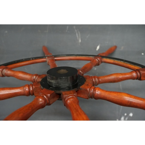 440 - A large Contemporary hardwood ships wheel, 150 cm in diameter.