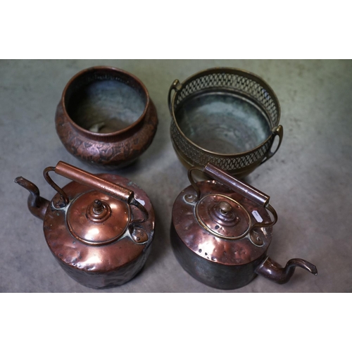 444 - A pair of antique copper kettles.