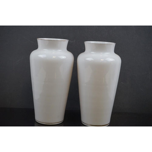 464 - An oriental Blanc de chine pierced vase together with a pair of early 20th century vases with huntin... 