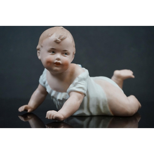 470 - A pair of Bisque china baby piano dolls