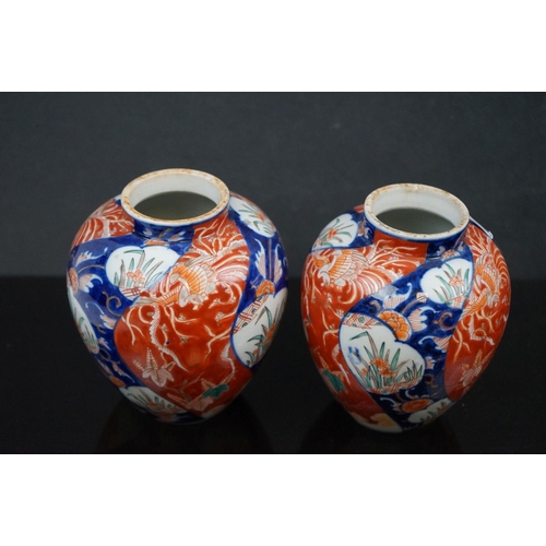 473 - A pair of Japanese Imari pattern vases together with a similar scalloped edged dish.