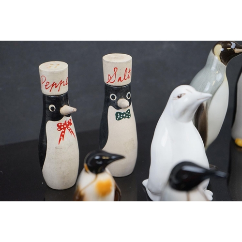 475 - A collection of ceramic Penguins to include Carlton Ware, Goebel and Coalport examples.