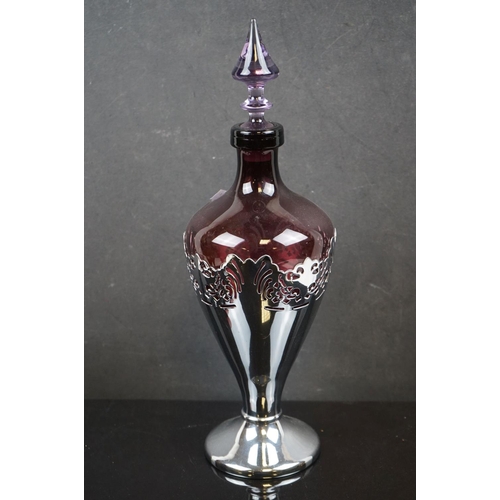 476 - Amethyst glass liqueur carafe by Faber Bros of New York together with Four Glasses