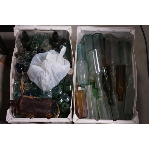 484 - A large quantity of antique glass bottles to include advertising and poison examples.