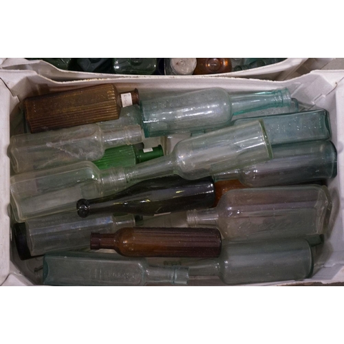 484 - A large quantity of antique glass bottles to include advertising and poison examples.