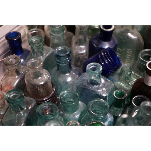 484 - A large quantity of antique glass bottles to include advertising and poison examples.