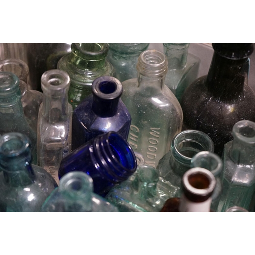 484 - A large quantity of antique glass bottles to include advertising and poison examples.