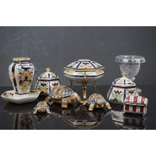 493 - A small collection of Noritake porcelain together with three Wade tortoises.