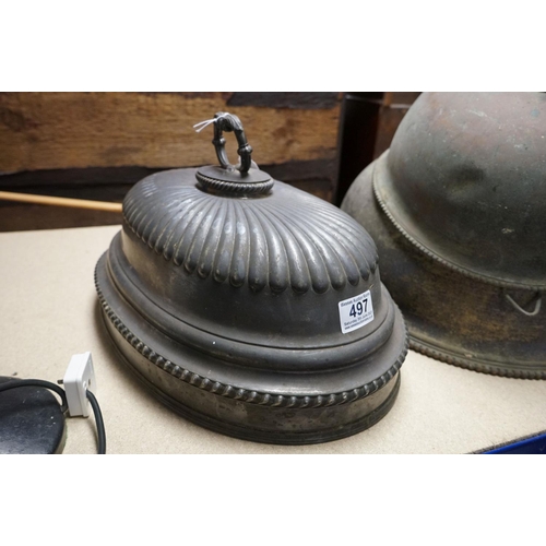 497 - Three antique silver plated Cloche's together with a wrought iron table lamp.