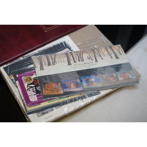 503 - A collection of Classic Disney Movies collector panels and stamps contained within two albums togeth... 