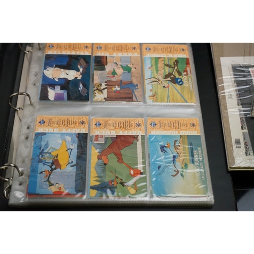 503 - A collection of Classic Disney Movies collector panels and stamps contained within two albums togeth... 