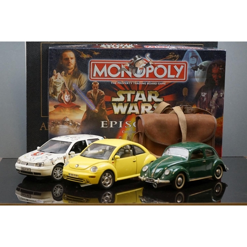 505 - A box of mixed collectables to include a Star Wars game, die cast vehicles and a camera.