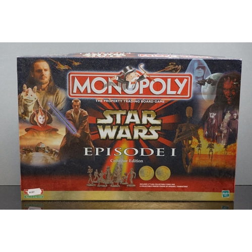 505 - A box of mixed collectables to include a Star Wars game, die cast vehicles and a camera.