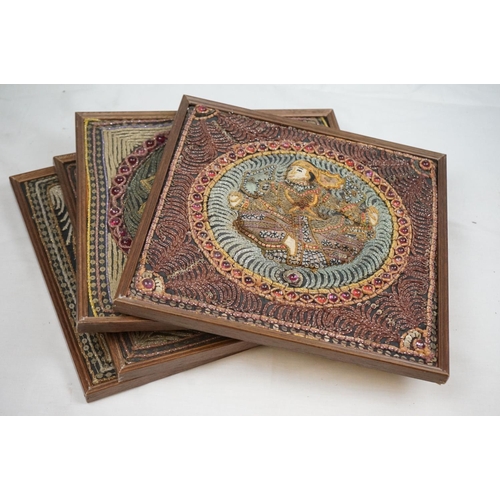 518 - A set of four framed Indian embroidered pictures.