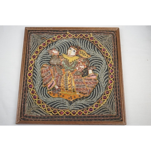 518 - A set of four framed Indian embroidered pictures.