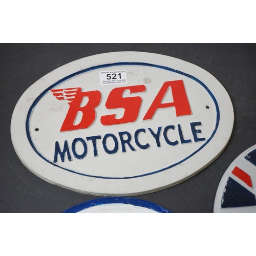 521 - A group of three reproduction cast iron signs to include BSA motorcycles.