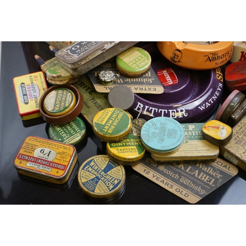 529 - A collection of advertising tins and ashtrays to include brewery examples.