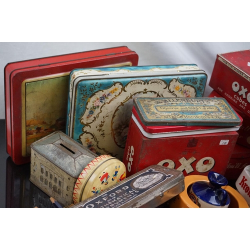 529 - A collection of advertising tins and ashtrays to include brewery examples.