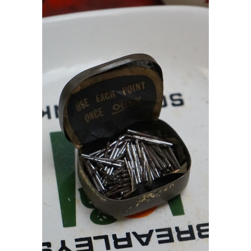 529 - A collection of advertising tins and ashtrays to include brewery examples.