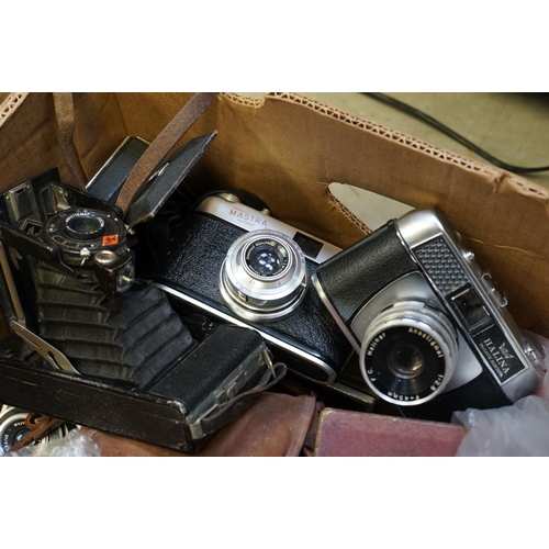 539 - A large collection of cameras and photographic equipment contained within two boxes to include Mamiy... 