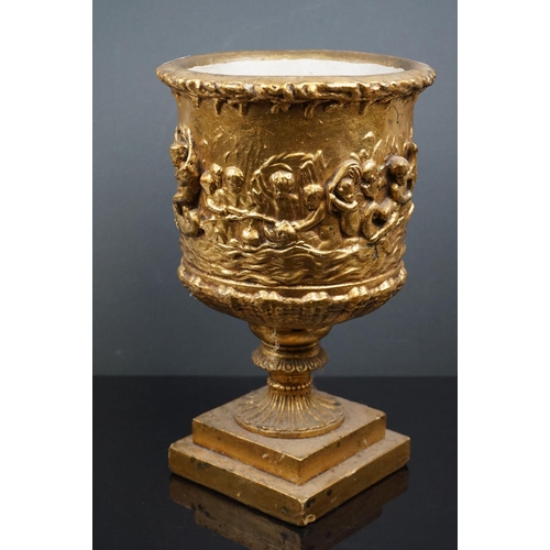 544 - Gold painted plaster planter of classical form decorated with cherubs