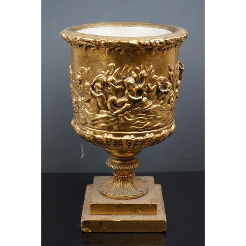 544 - Gold painted plaster planter of classical form decorated with cherubs