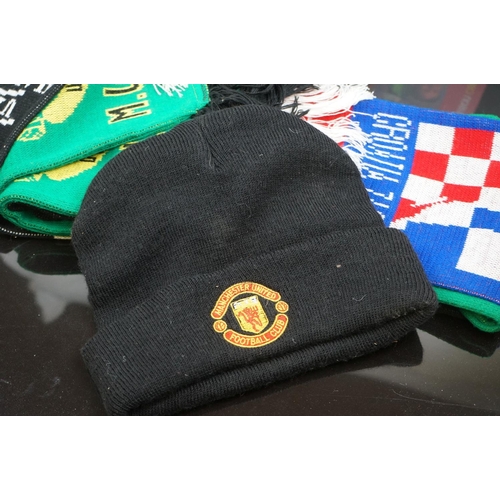 548 - A group of football related collectables to include scarf, book, figures and bags.