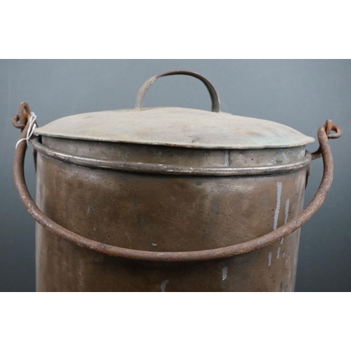 551 - A large lidded copper bucket together with a world war one bayonet.