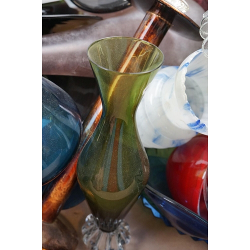 554 - A group of coloured glass to include vases,candlestick glasses etc.